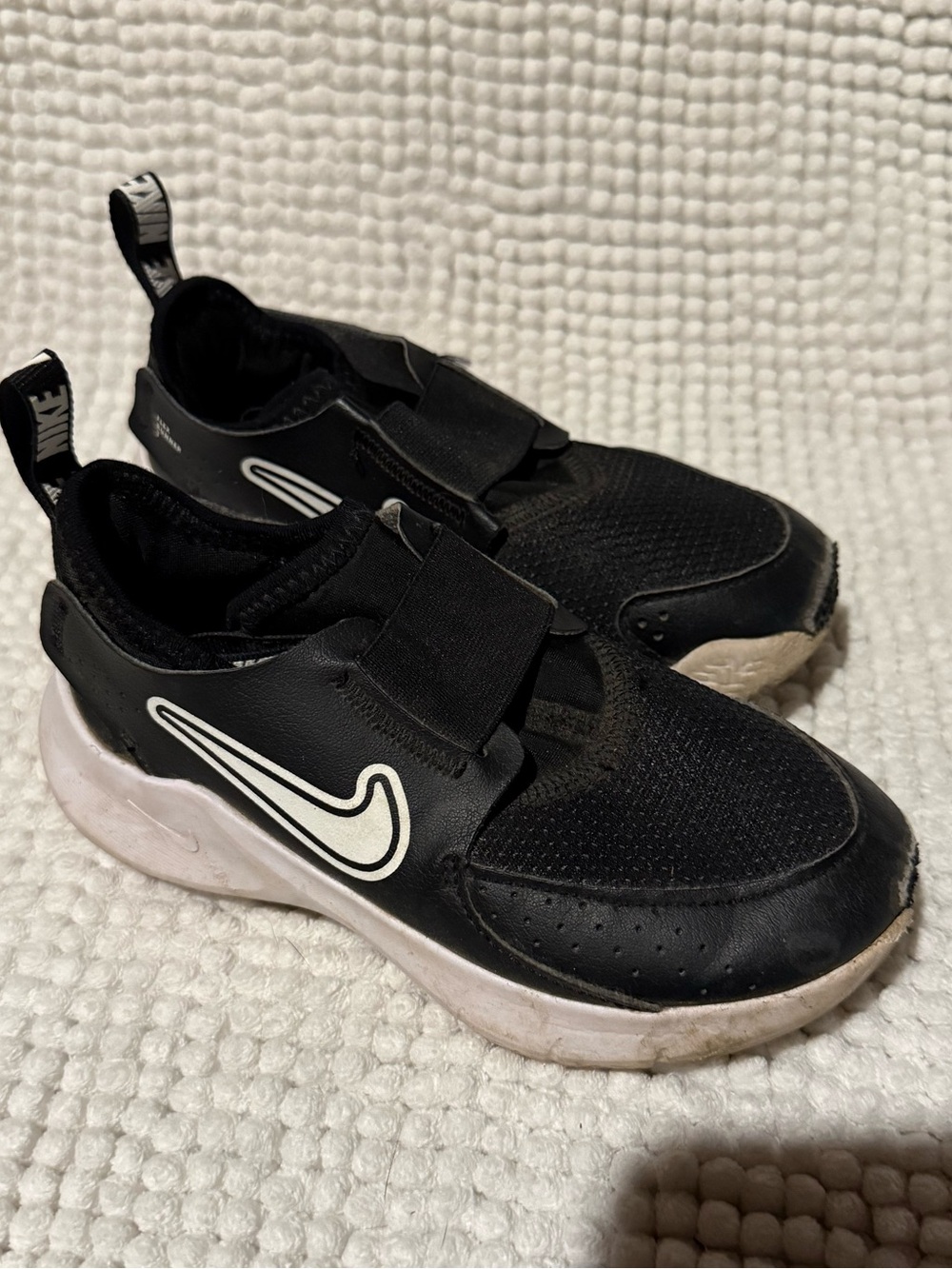 Nike Kids Black Slip-On Sneakers with White Swoosh